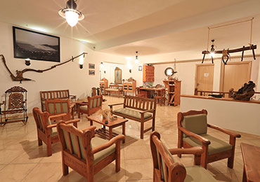 The reception desk and the sitting area of the hotel